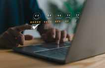 A person is typing on a laptop